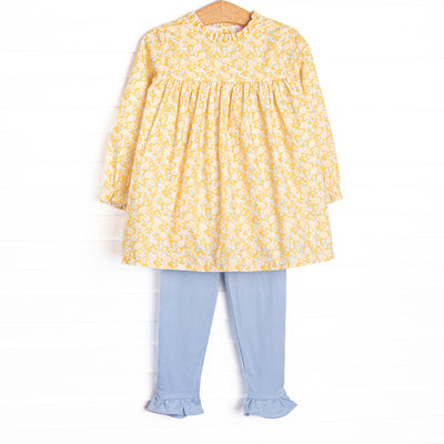  This set features a yellow floral fabric, a yellow ruffle collar, and long sleeves. Coordinating blue leggings to match. 