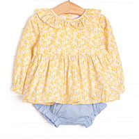 This set features a yellow floral fabric, a yellow ruffle collar, and long sleeves. Coordinating blue diaper cover to match.