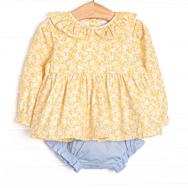 This set features a yellow floral fabric, a yellow ruffle collar, and long sleeves. Coordinating blue diaper cover to match.