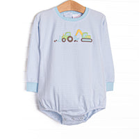 This bubble features a blue striped top, dig machines applique, and long sleeves.