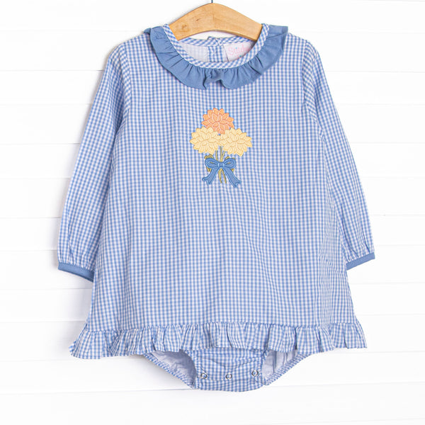  This skirted bubble features a blue gingham fabric, a blue ruffle collar, and a mum applique. 
