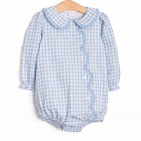 This bubble features blue plaid fabric, a ruffle Peter Pan collar, front buttons, and scalloped edges.