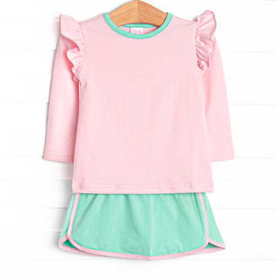 This set features a pink top with flutter shoulders and green trim. Coordinating mint green skirt with pink trim.