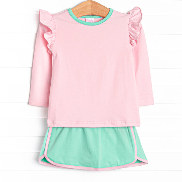 This set features a pink top with flutter shoulders and green trim. Coordinating mint green skirt with pink trim.