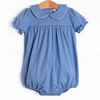 This bubble features a blue knit material, puff sleeves, and a peter pan collar.