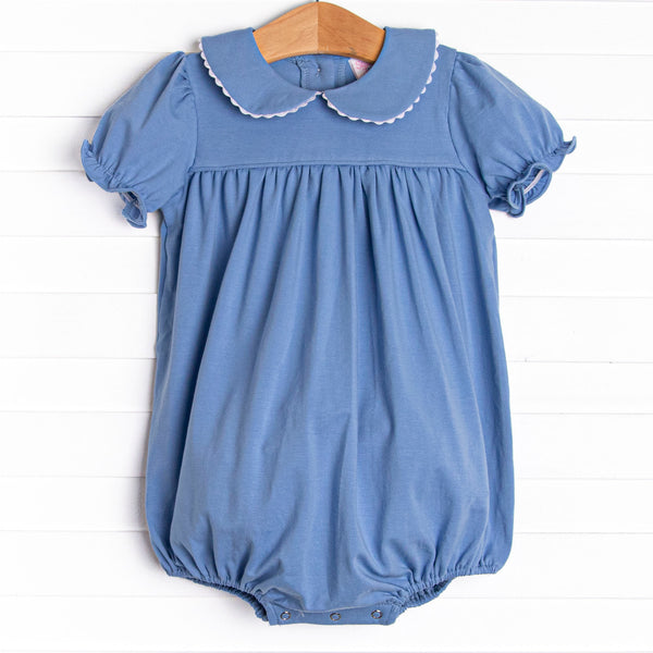 This bubble features a blue knit material, puff sleeves, and a peter pan collar.