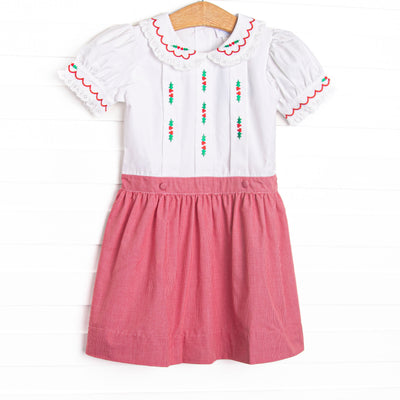  This dress features white fabric, red mini gingham fabric, a white Peter Pan collar, and holly embroidery. 