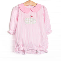 This bubble features pink stripes, a golfing green applique, and a pink Peter Pan collar.