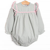  This bubble features a sage gingham print, pink ric rac trim, and flutter sleeves. 