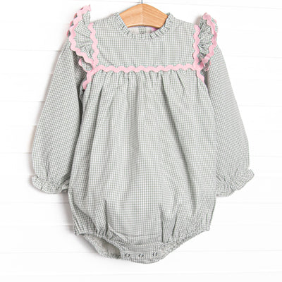  This bubble features a sage gingham print, pink ric rac trim, and flutter sleeves. 