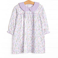  This dress features a purple floral print, a purple peter pan collar and the softest knit material. 