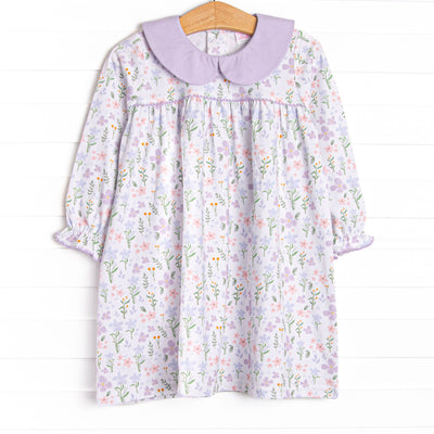  This dress features a purple floral print, a purple peter pan collar and the softest knit material. 
