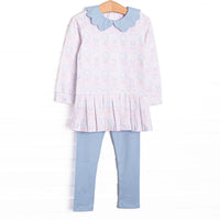 This set features pink gingham and golf fabric, a blue scalloped collar, and a pleated hem. Coordinating blue leggings to match.