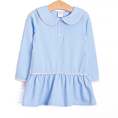 This dress features blue fabric, a Peter Pan collar, front buttons, and pink ric rac trim.