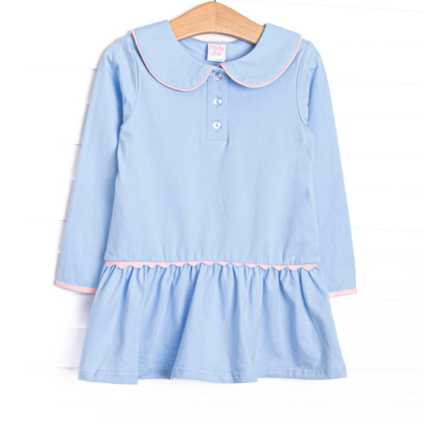This dress features blue fabric, a Peter Pan collar, front buttons, and pink ric rac trim.