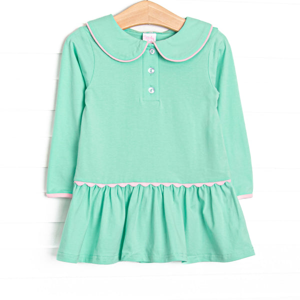  This dress features green fabric, a Peter Pan collar, front buttons, and pink ric rac trim. 