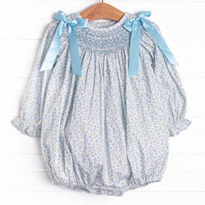  A long sleeve bubble with a blue smocking and blue bow details on the shoulders.&nbsp; 