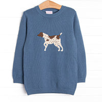 This sweater features a blue material, a rolled neck, and a puppy icon.