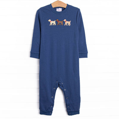 This romper features a navy blue knit material, snaps on the stride, and puppy appliques.