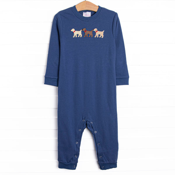 This romper features a navy blue knit material, snaps on the stride, and puppy appliques.