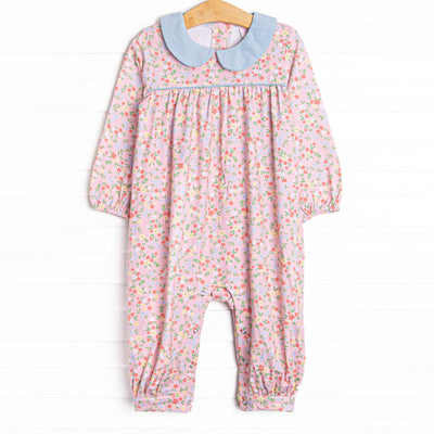  This romper features a pink floral print, a blue peter pan collar, and snaps on the stride. 