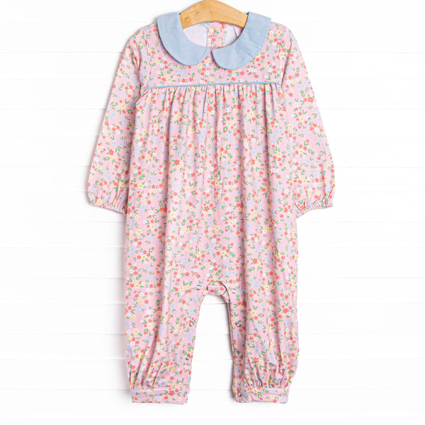  This romper features a pink floral print, a blue peter pan collar, and snaps on the stride. 