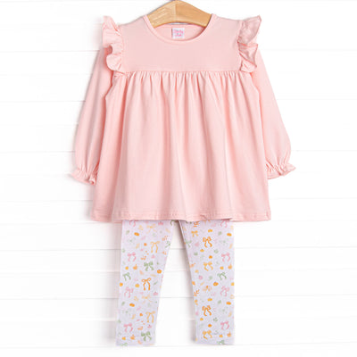 This set features a pink ruffle top and bow and pumpkin print leggings