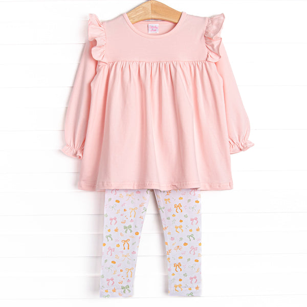 This set features a pink ruffle top and bow and pumpkin print leggings