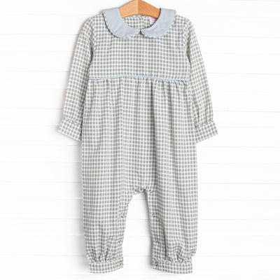  This romper is featured in green gingham print, with a blue peter pan collar and snaps on the stride to make changing a breeze. 