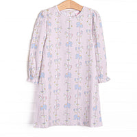 This dress features pink knit fabric, a carousel pattern, and long sleeves. 