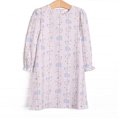  This dress features pink knit fabric, a carousel pattern, and long sleeves. 