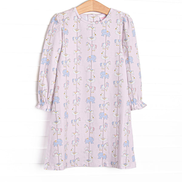  This dress features pink knit fabric, a carousel pattern, and long sleeves. 