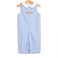  This Jon Jon features a blue gingham print, a white Peter Pan collar, and pumpkin embroideries. 