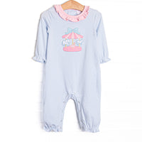 This romper features blue striped fabric, a pink ruffle collar, a carousel applique, and snaps along the stride to make changing a breeze.