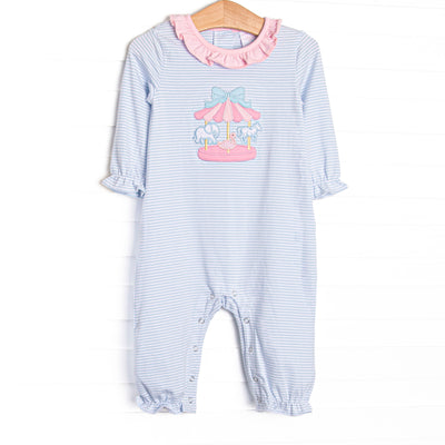 This romper features blue striped fabric, a pink ruffle collar, a carousel applique, and snaps along the stride to make changing a breeze.