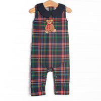 This Jon Jon features navy plaid material, a teddy bear applique, a navy Peter Pan collar, and snaps along the stride to make changing a breeze.