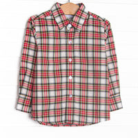  This top features a red tartan print,&nbsp;polo collar, and buttons. 