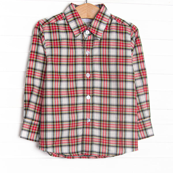  This top features a red tartan print,&nbsp;polo collar, and buttons. 