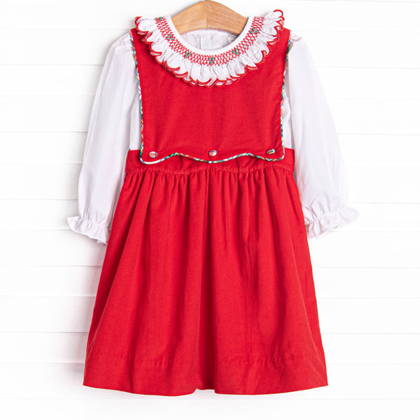  Bleu features a beautiful combination of timeless elegance and charm, curated with intricate details and crafted from premium fabrics! This dress set&nbsp; features a white top with a festive smocked ruffle collar and a red corduroy jumper dress with scalloped plaid trim. 