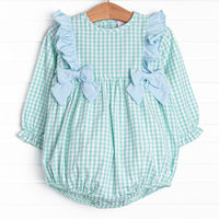  This bubble features a mint green gingham print, snaps on the stride, and blue ruffles and bows. 