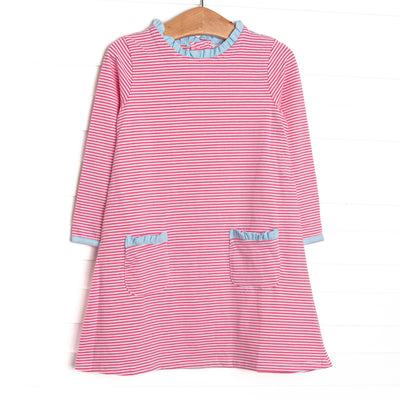  This dress features medium pink stripes, front pockets, and blue ruffle trim. 