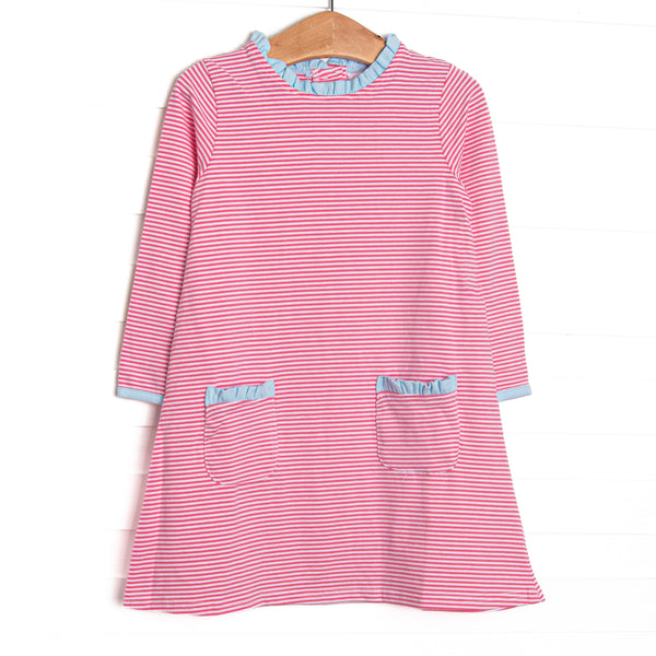  This dress features medium pink stripes, front pockets, and blue ruffle trim. 