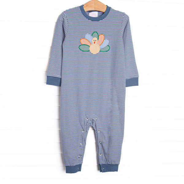 This romper features a navy striped knit material, snaps on the stride, and a turkey applique.