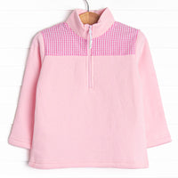  It has gingham on the shoulders, a quarter zip, and the coziest fleece material. 