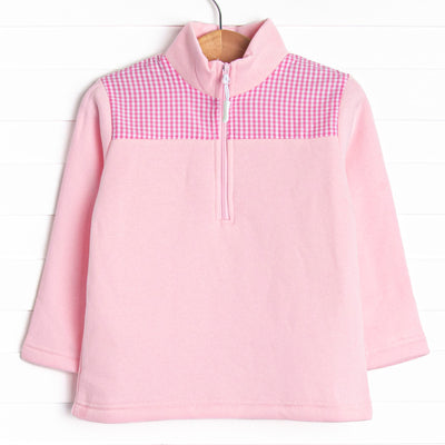  It has gingham on the shoulders, a quarter zip, and the coziest fleece material. 