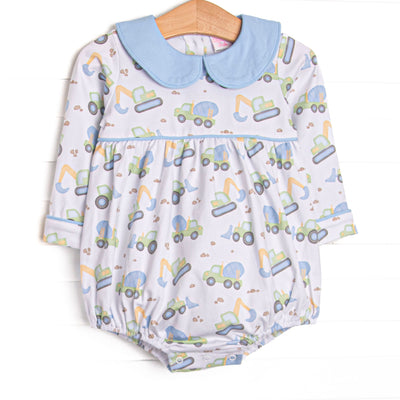 This bubble features a construction print, blue peter pan collar, and snaps on the stride to make changing a breeze.