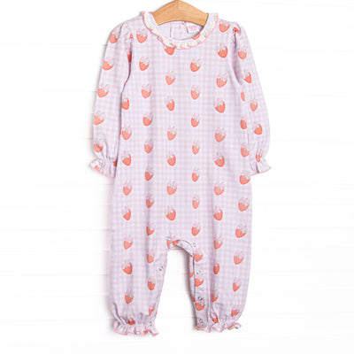 This romper features pink gingham and strawberry printed fabric, a white ruffle collar, and snaps along the stride to make changing a breeze.