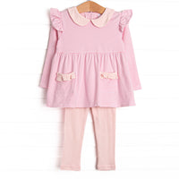  The set features pink stripes, a pink peter pan collar, and pink knit leggings. 