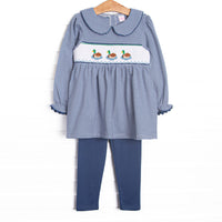 This set features navy striped fabric, duck smocking, and a navy striped Peter Pan collar. Coordinating navy leggings to match.