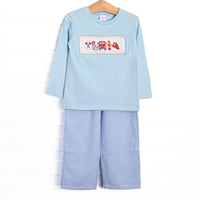 This set features a blue knit top, fire truck and puppy smocking, and blue gingham trim. Coordinating blue mini gingham pants to match.
